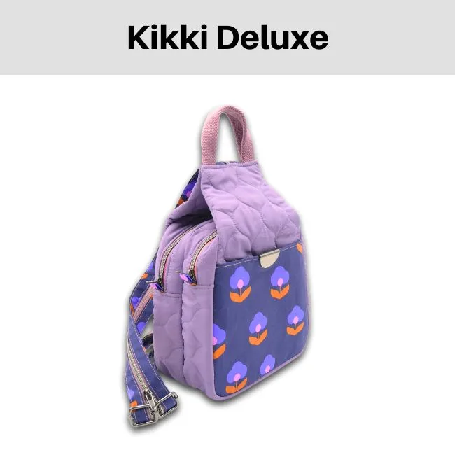 Ein violetter Rucksack mit zwei Reißverschlüssen